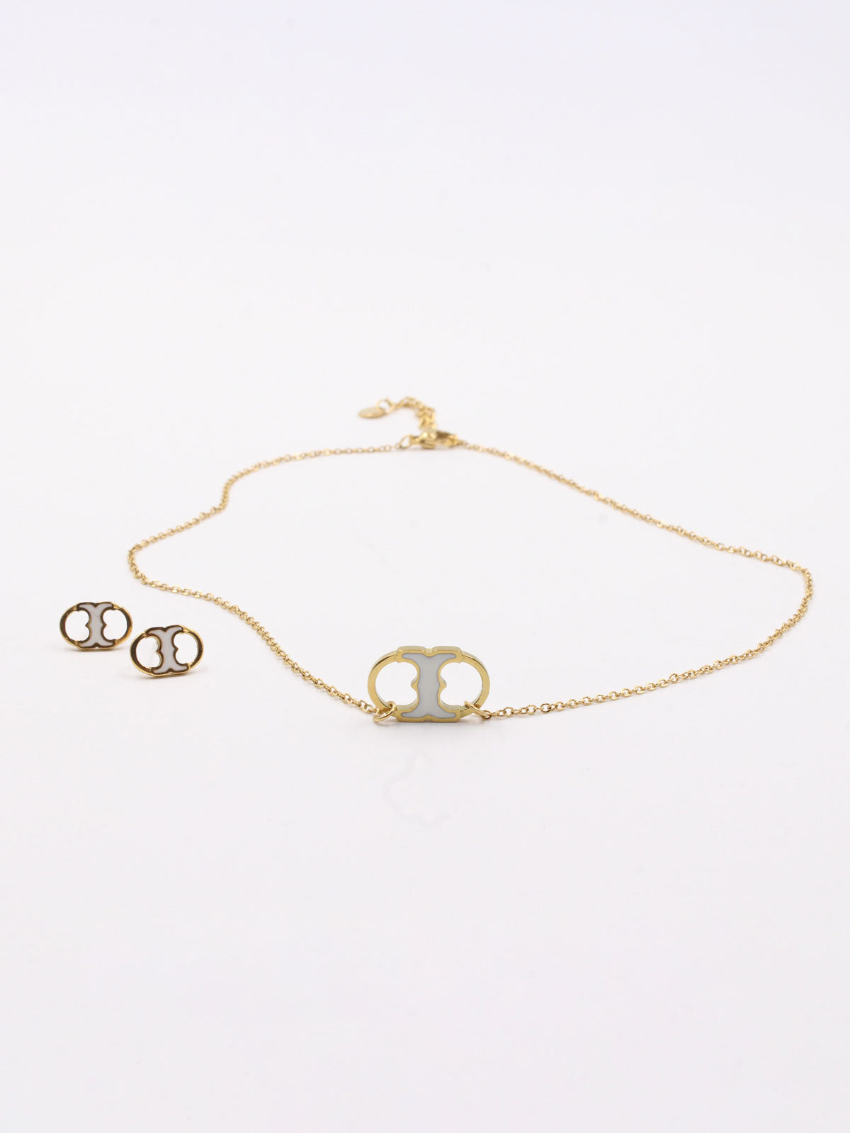 طقم توري بورش ناعم -Tory Burch Set اطقم tory burch ابيض ذهبي
