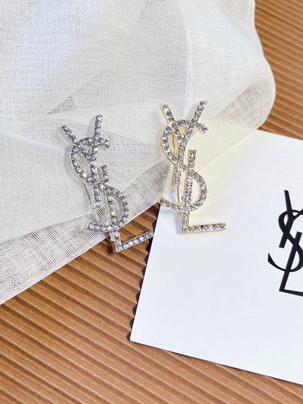 بروش ماركة ايف سان لوران كريستال بروش ysl