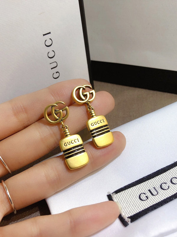 حلق قوتشي ذهبي بالشعار حلق gucci ذهبي