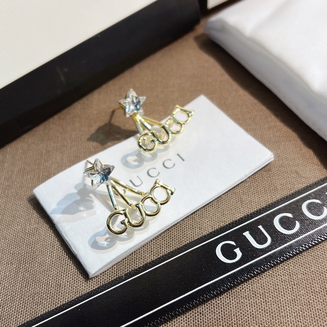 حلق قوتشي ستار سايد لوقو حلق gucci