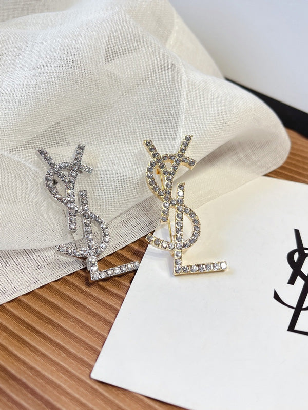 بروش ماركة ايف سان لوران كريستال بروش ysl