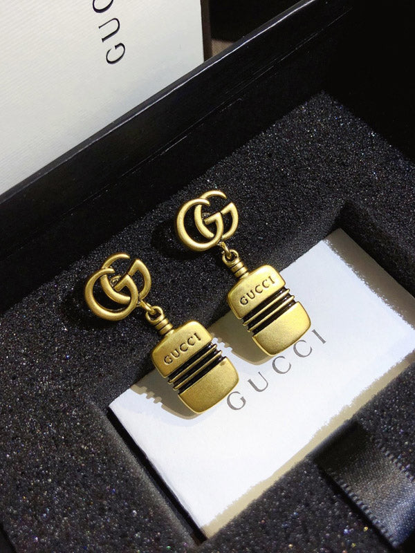 حلق قوتشي ذهبي بالشعار حلق gucci