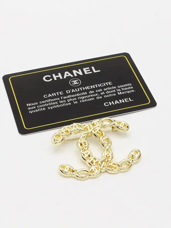 بروش شانيل ميتال لوقو 219 بروش chanel ذهبي