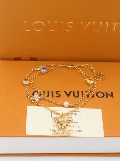 اساور لويس فيتون موف ستون دبل لاينز لوقو ماستر اسواره louis vuitton ذهبي