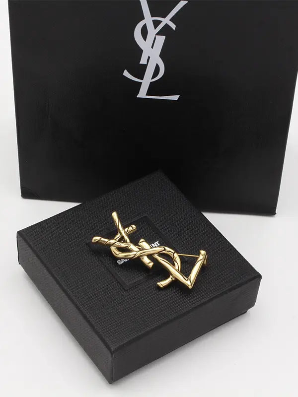 بروش ايف سان لوران انتيك قولد بروش ysl