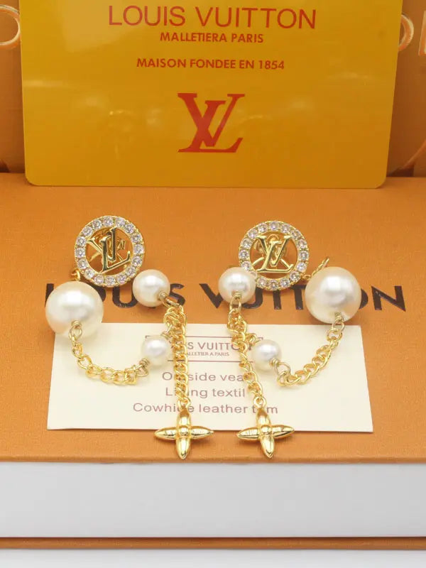 حلق لويس فيتون لونق بيرل زركون ماستر 701 حلق louis vuitton ذهبي