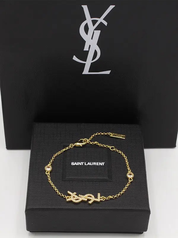 اساور ايف سان لوران انسيال زركون لوقو اسواره ysl ذهبي