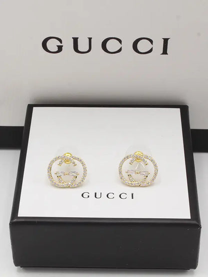 حلق قوتشي 97 لوقو زركون حلق gucci ذهبي