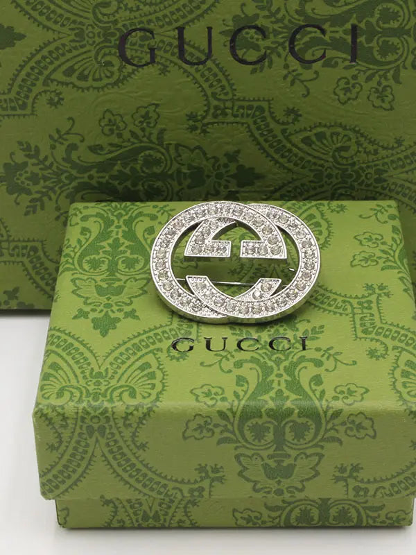 بروش قوتشي كرستال بروش gucci فضي