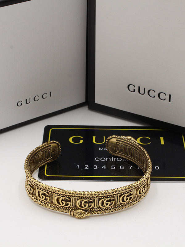 اساور قوتشي عريضه لوقو برونز اسواره gucci ذهبي