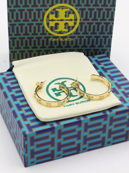 حلق توري بورش مدور وسط حلق tory burch ذهبي 