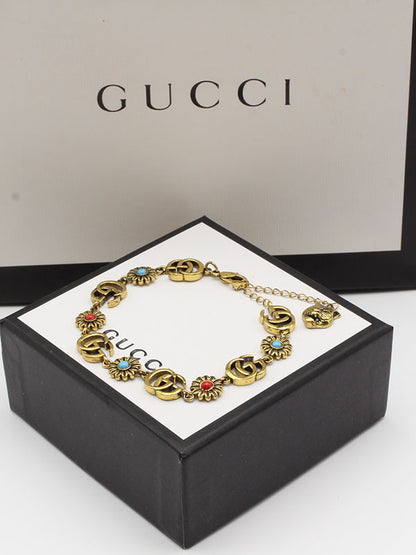 اسواره قوتشي احجار ملونه شعار اسواره gucci ذهبي 