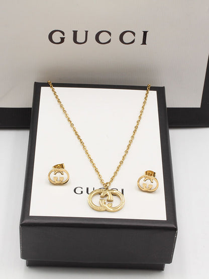 طقم قوتشي ناعم ذهبي اطقم gucci ذهبي