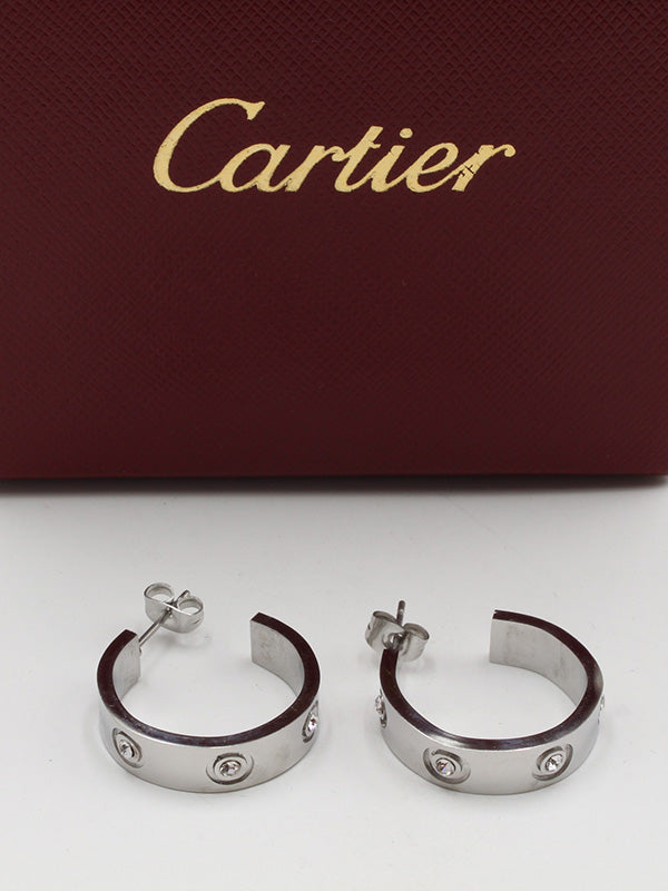 حلق كارتير فضي مدور حلق CARTIER