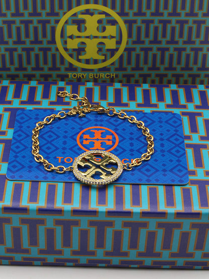 اساور توري بورش زركون مدوره اسواره tory burch ذهبي