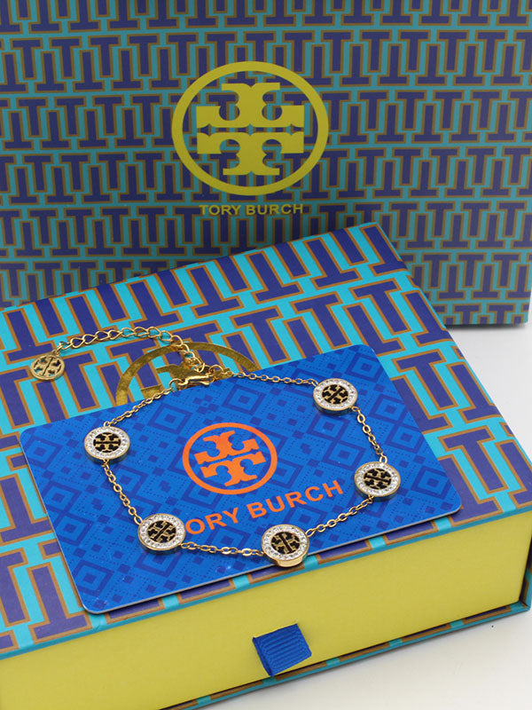 اساور توري بورش زركون وسط اسواره tory burch ذهبي