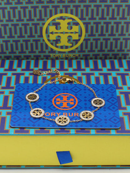 اساور توري بورش زركون صغير اسواره tory burch ذهبي