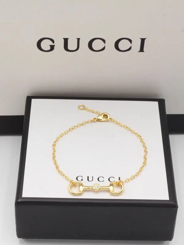 اسواره قوتشي نيو لوك لوقو 877 اسواره gucci ذهبي