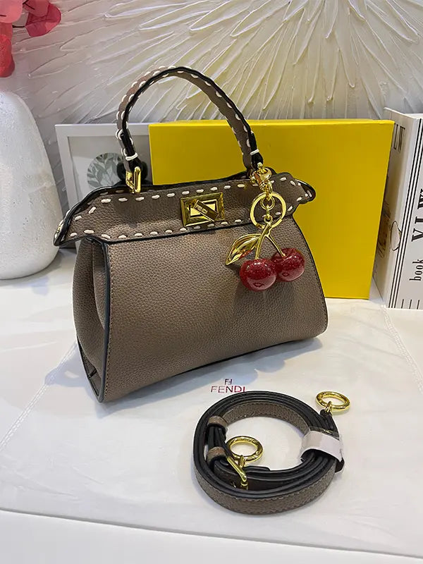 شنطة فندي بنية بتعليقه كرز شنط وحقائب fendi bags