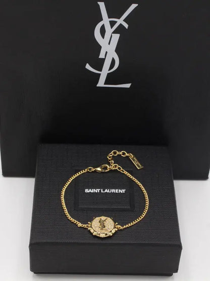 اساور ايف سان لوران 880 اسواره ysl ذهبي
