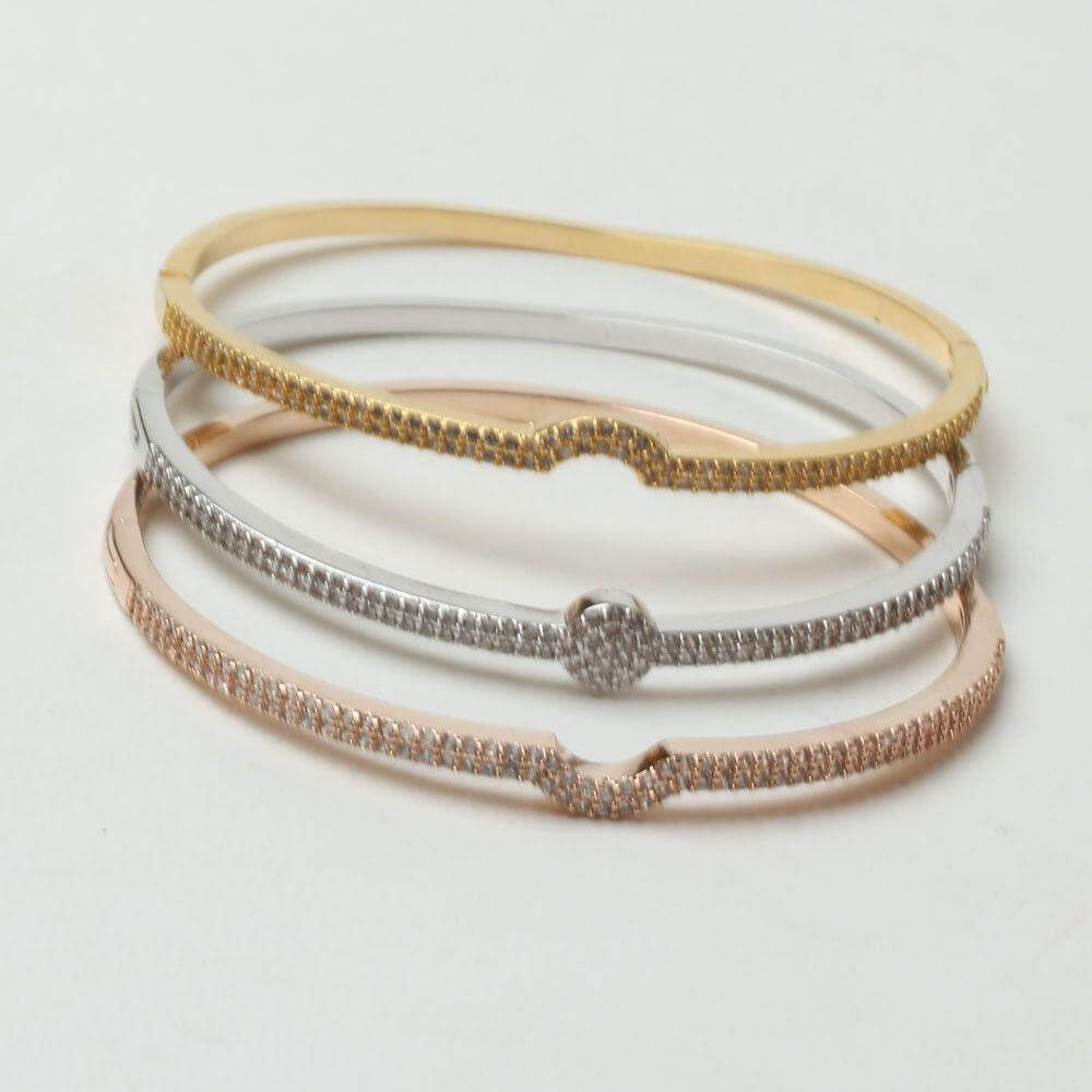 اساور وخواتمها مرصعه بالزركون بشكل مقوس اسواره متوفر 1 لون  