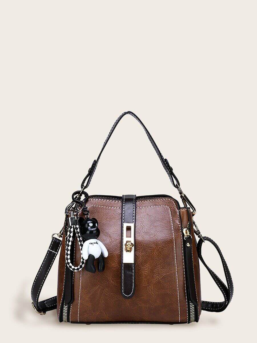 حقيبة جلد بني فاخر بتعليقة دب شنط وحقائب شنط