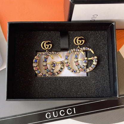 حلق قوتشي انتيك كبير حلق gucci ذهبي 