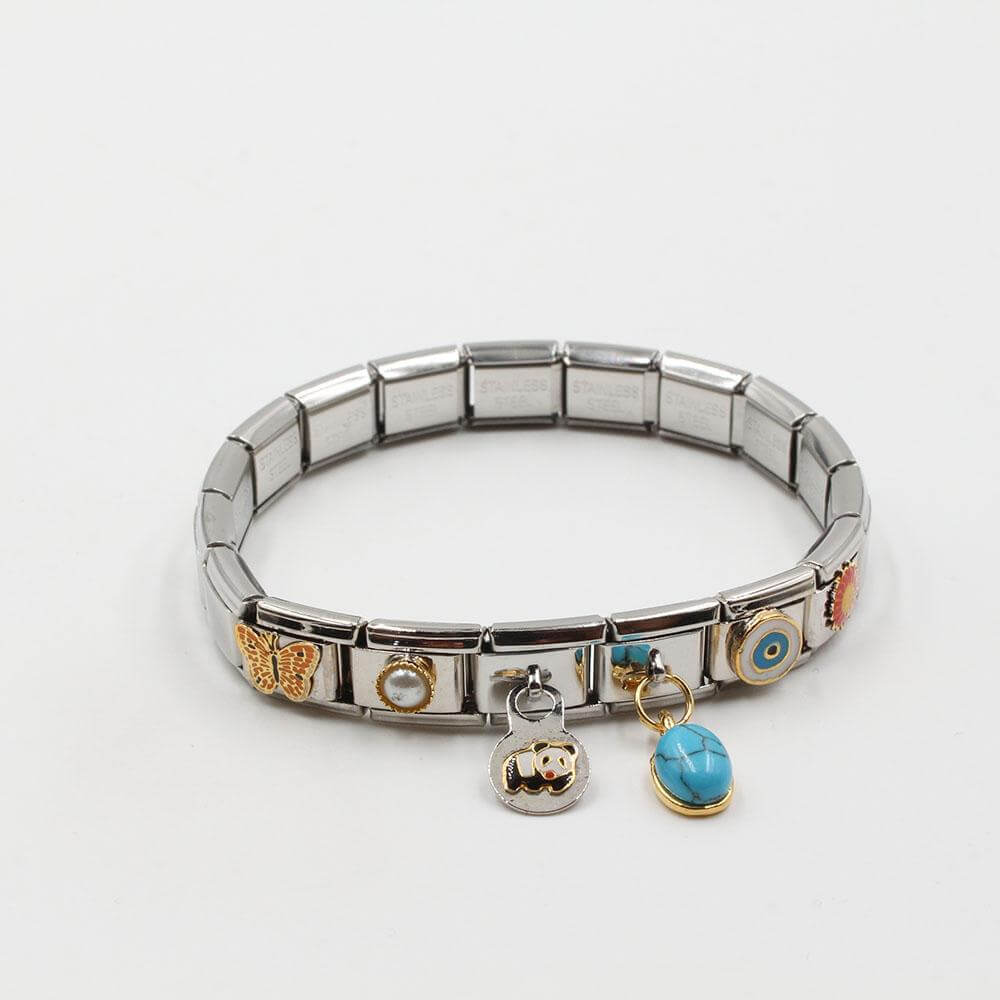 اسوارة نومنيشن ستانلس ستيل دبندنتس بحجر تركواز اسواره nomination فضي